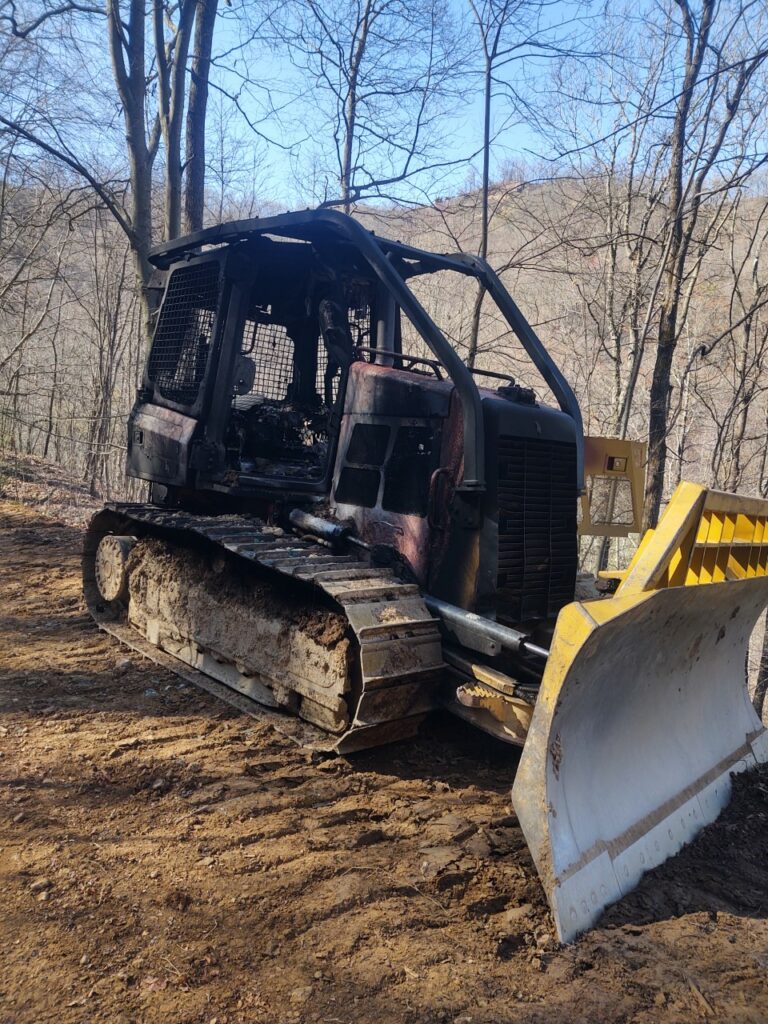 Arson suspected in bulldozer being torched on trail system