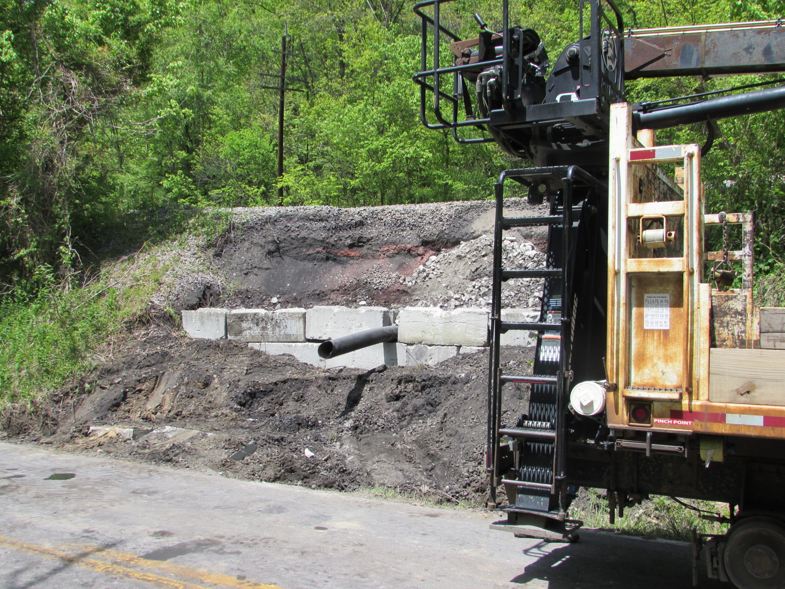 Norfolk Southern railroad embankment slide being repaired near Tug River