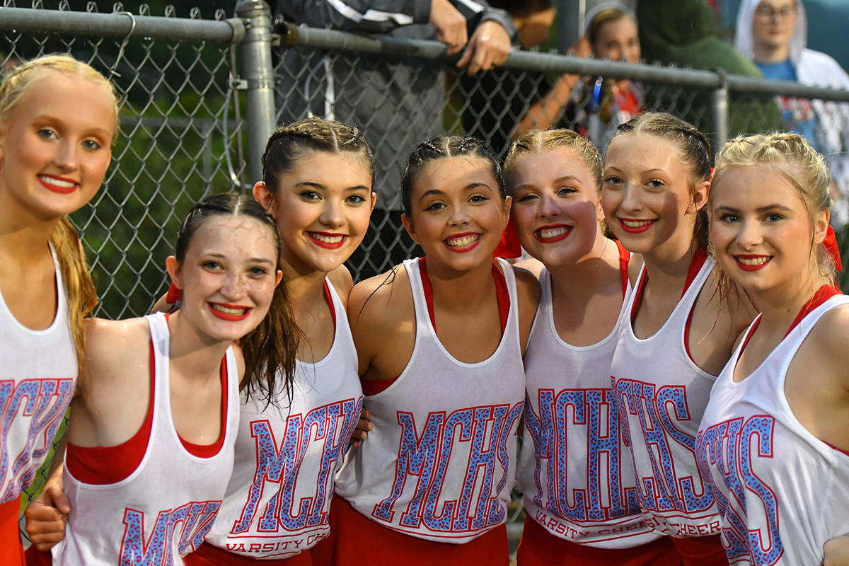 MCHS Cheerleaders battle the rainy weather